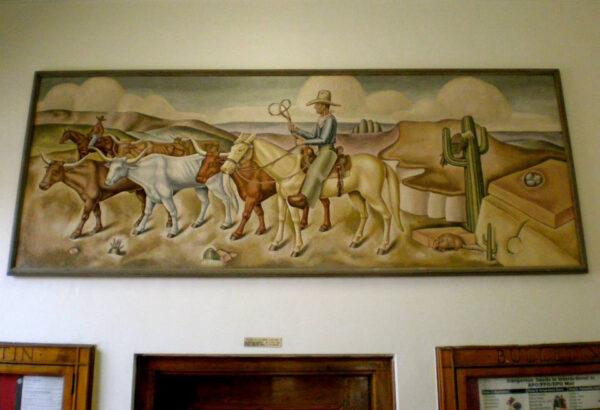 mural of a cowboy and cattle above a post office door