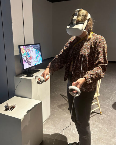 Visitor using a VR headset in a gallery