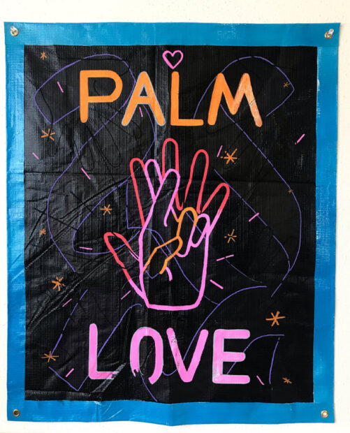 Painting of the words Palm Love with a hand in the center