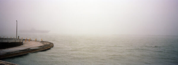 A photograph of the Gulf of Mexico obscured by fog.