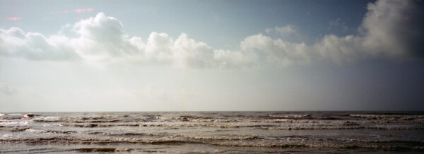 A photograph of the ocean and sky.