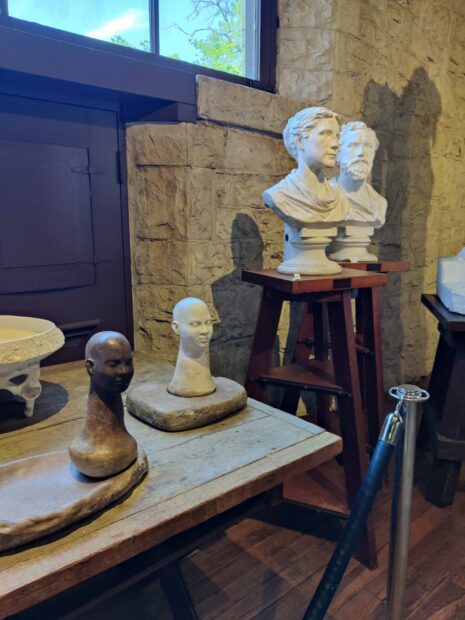 Installation image of busts in a space