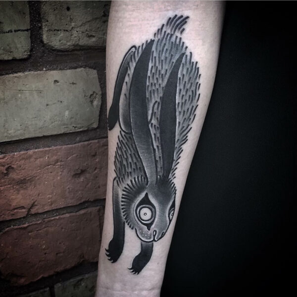 Tattoo of a rabbit on the artists forearm