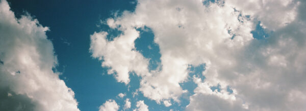 A photograph of clouds in a blue sky.