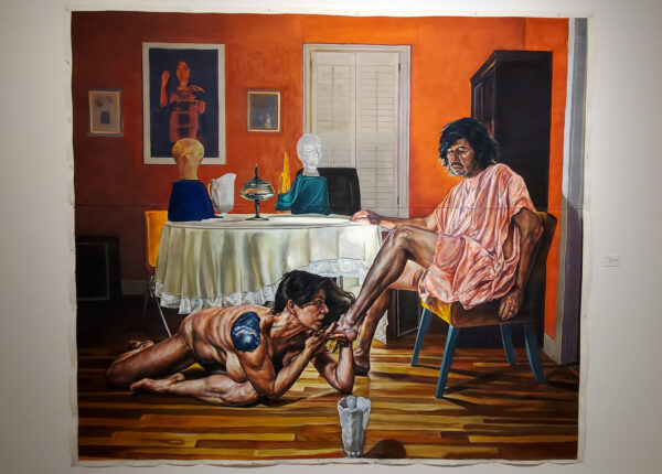 Large scale painting of a woman washing a man's feet with her hair