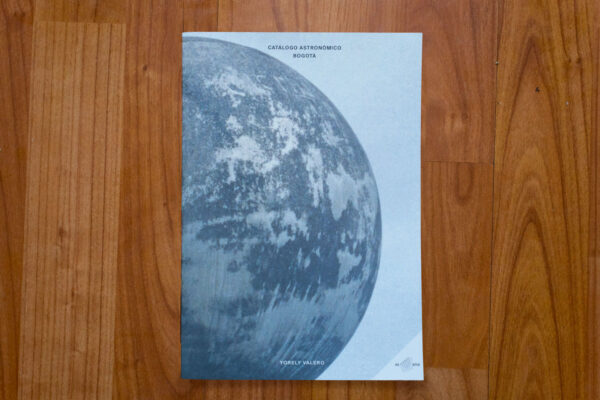 Picture of a photo book cover with the side of a planet on one side