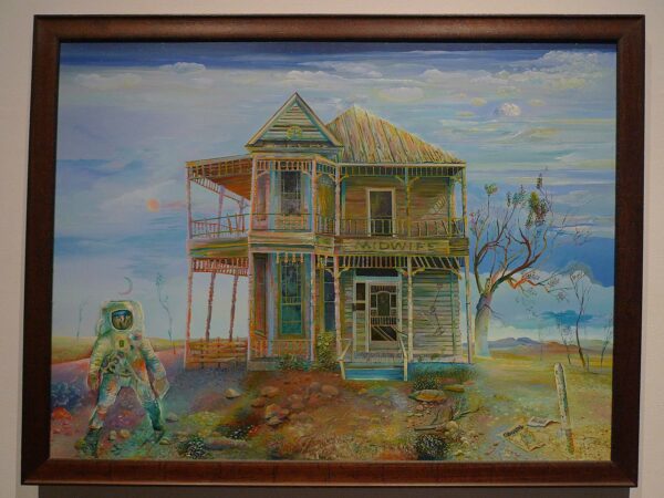 Painting of an old home with an astronaut in the foreground