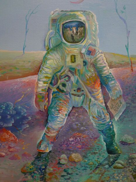 Detail of an astronaut in a barren landscape
