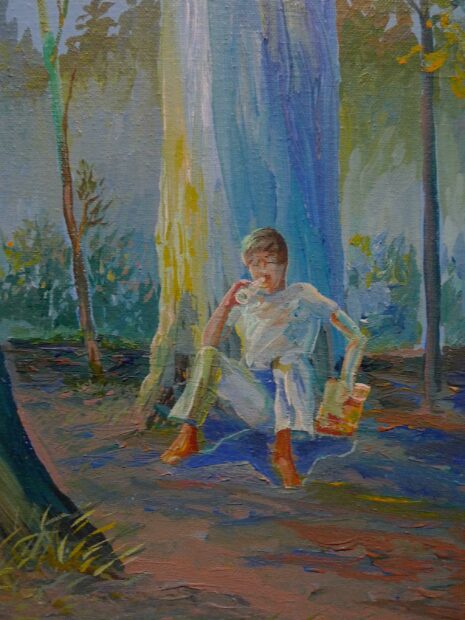 Detail of a boy drinking a coke sitting at the base of a tree