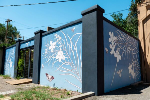 Blue and white mural of plants