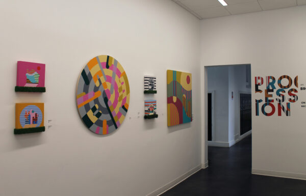 Installation view of works on a white wall