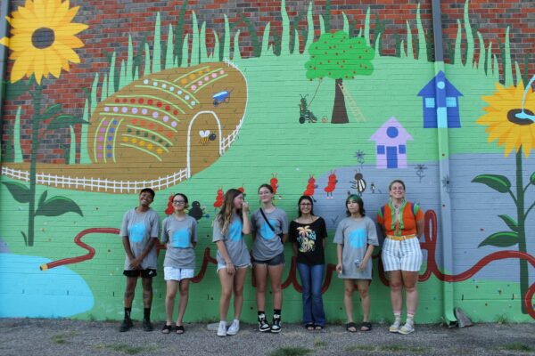Photo of students in front of the mural they painted
