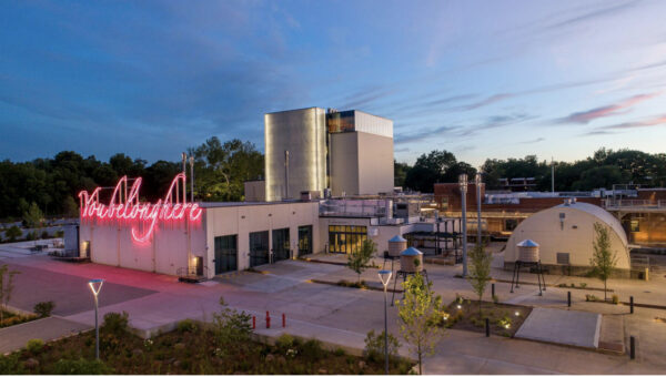 Image of the momentary museum with the neon sculpture saying "we belong here"