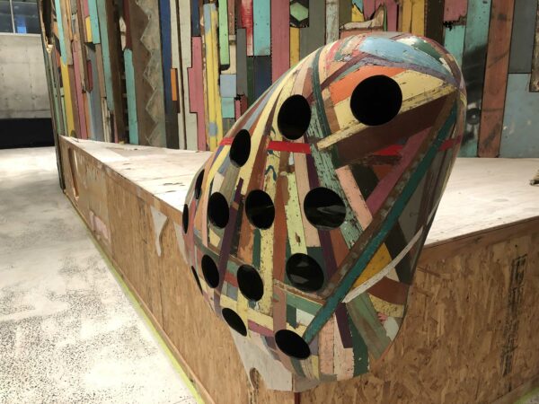 Mixed media installation of cardboard and colored wood sculpture