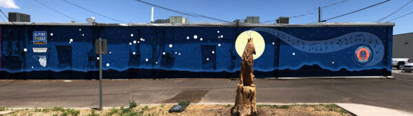 Image of a rendering of a long blue mural with a coyote howling at the moon