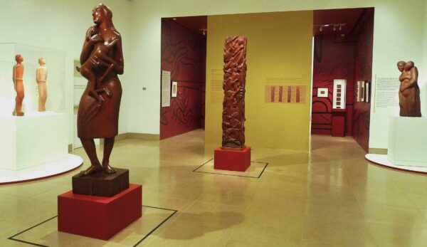 Installation view of figurative sculptures in a gallery