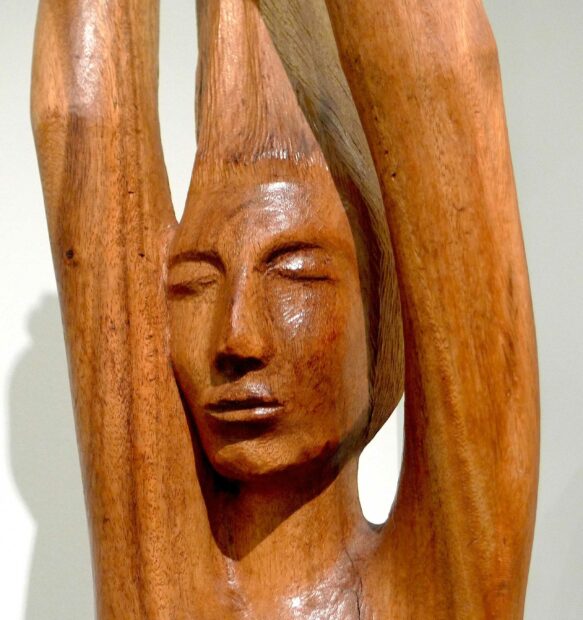 Wood sculpture of a woman bather