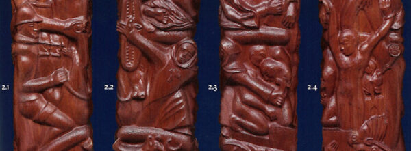 Photo of four bas relief sculptures of revolutionaries in wood