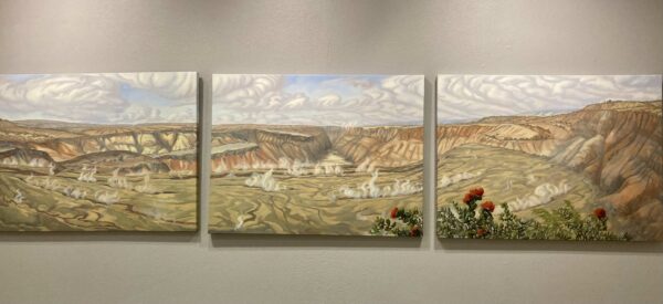 Triptych of a landscape painting of a crater