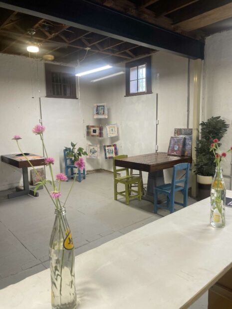Photo of a studio with flowers in a bottle