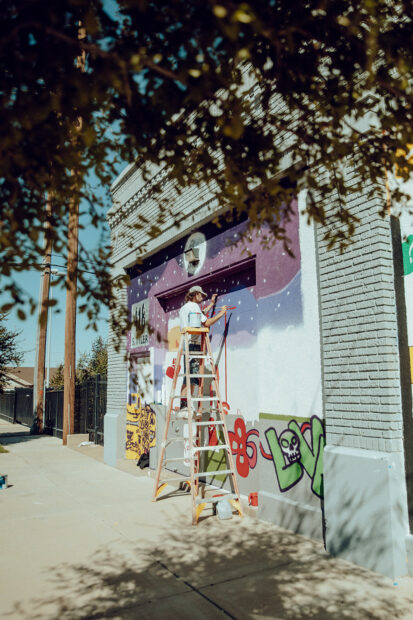 A photograph of a mural painting in progress.