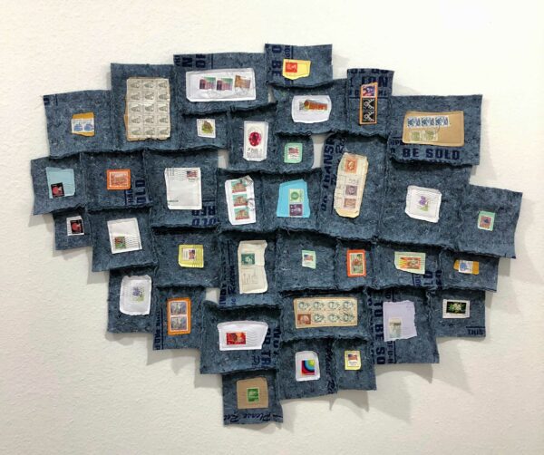 cluster of felt moving blankets in squares with postage stamps