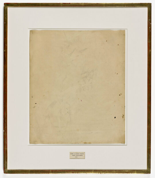 A photograph of a work by Robert Rauschenberg with traces of a drawing that have been erased on paper.