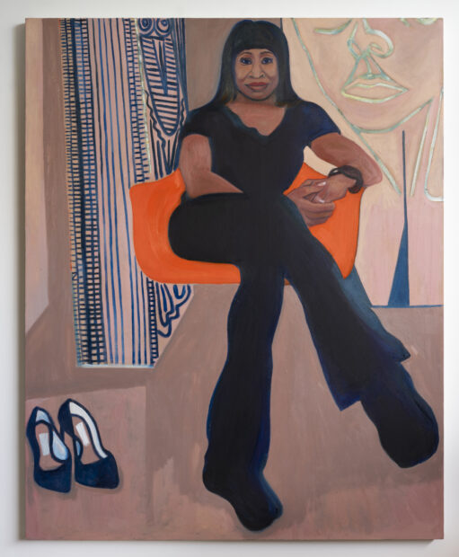 Portrait of a woman sitting in an orange chair