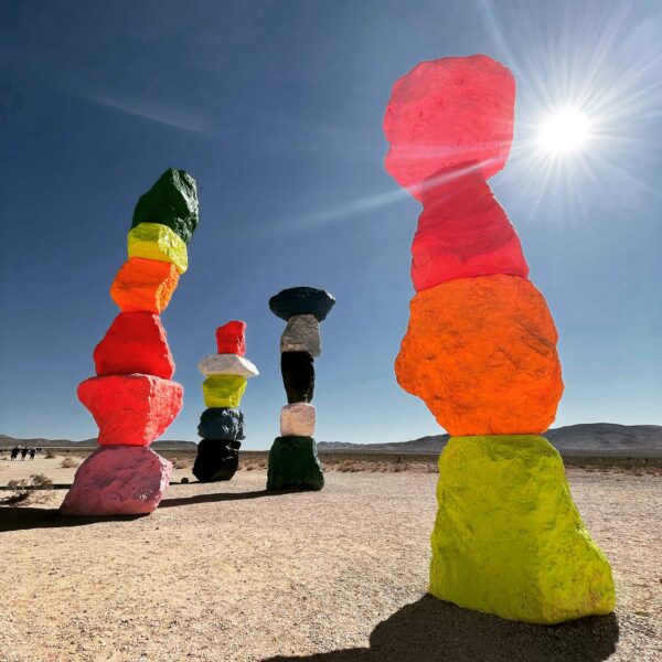 Photo of colorful rocks stacked in towers in the desert