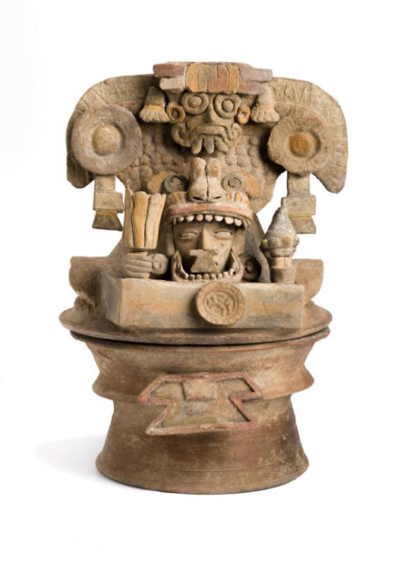 A photograph of a ceramic Mayan sculpture.