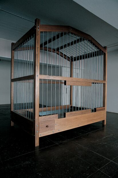 A photograph of a sculpture by Mona Hatoum that resembles a large birdcage.