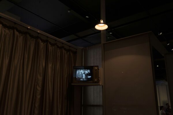 Photo of a small antique television in a corner