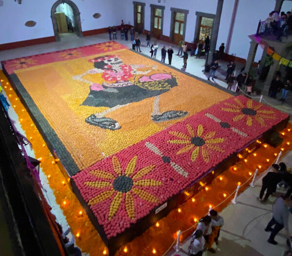 Photo of a catrina scene made from mexican sweet bread