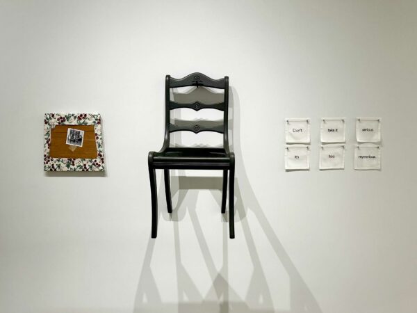 Installation view of a chair on a wall