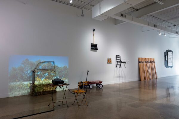 Installation view of works on walls and sculptural works in the space
