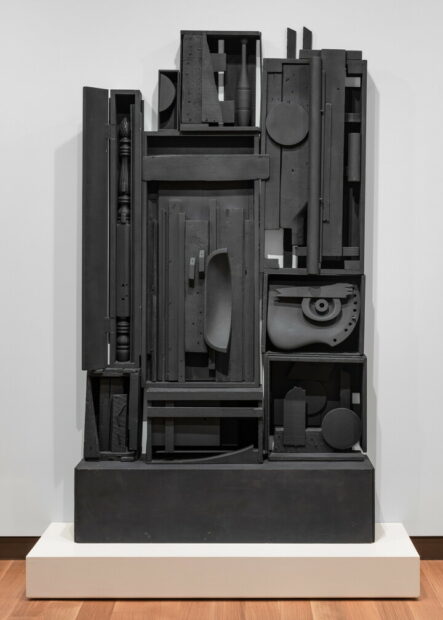 A photograph of a large assemblage sculpture by Louise Nevelson.