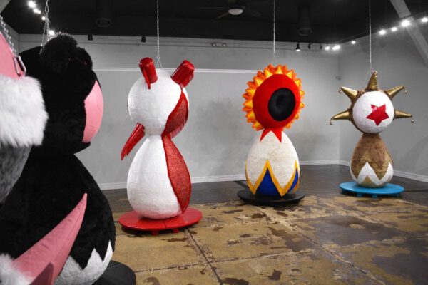 A photograph of a handful of large inflatable furry sculptures.