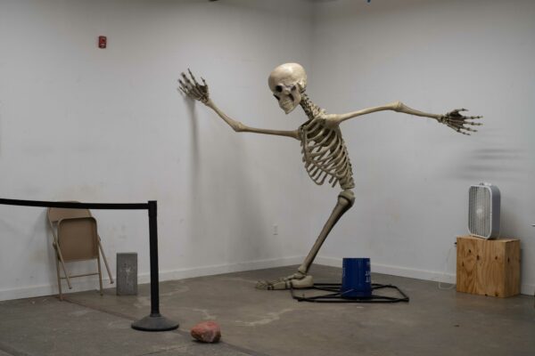 Skeleton standing in a corner