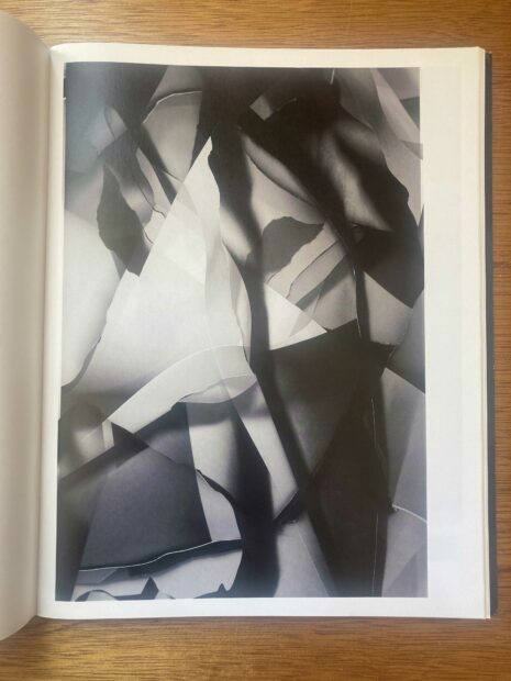 Photo of a page from a photo book of an abstract black and white image