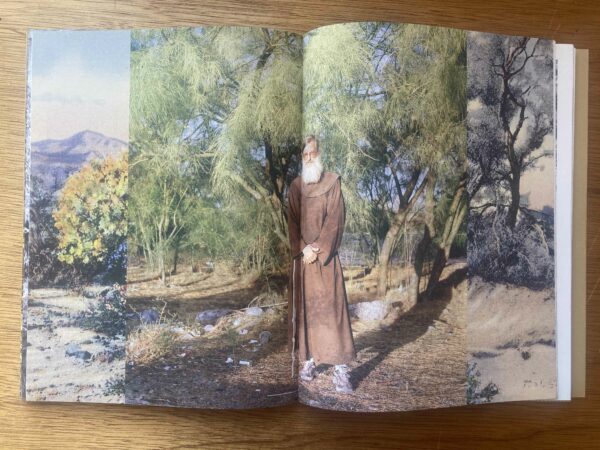 Photo of a man in religious robes in a photo book