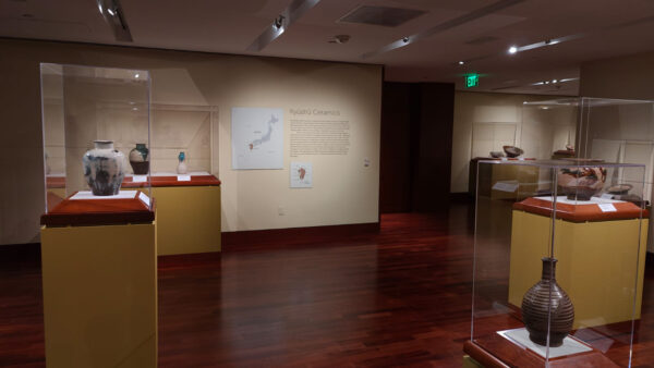 Installation view of antique ceramics in a gallery
