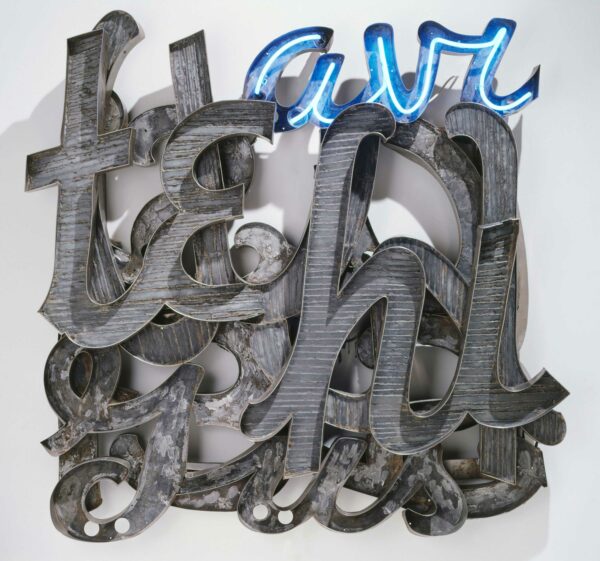 Photo of letters in aluminum, steel, and neon
