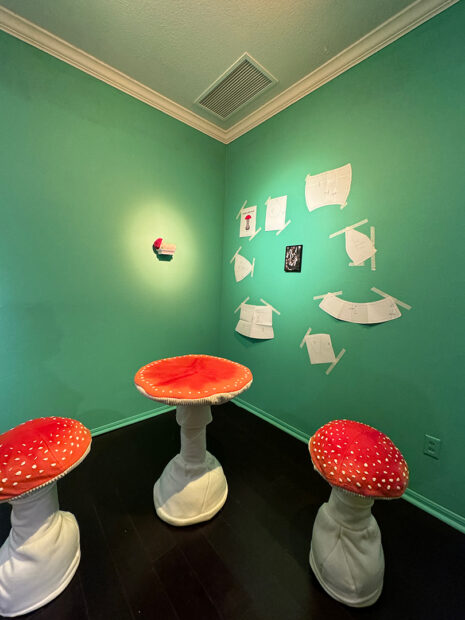 An installation image of sewn sculptures of mushrooms by Braeden Kuppin.