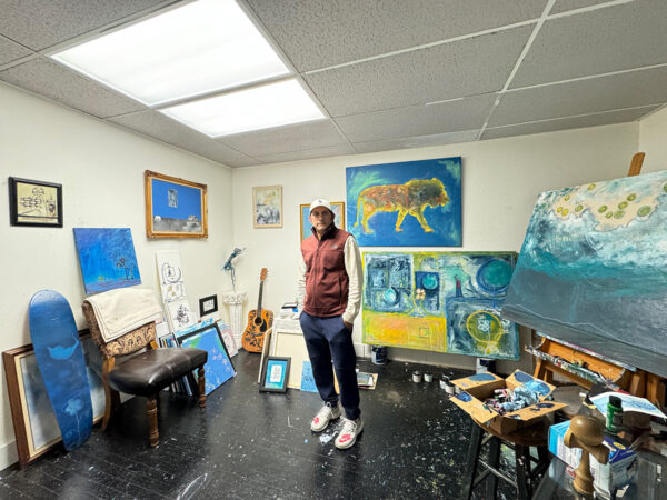 A photograph of artist Anthony Fuentez in his studio at the Center for Contemporary Arts in Abilene.