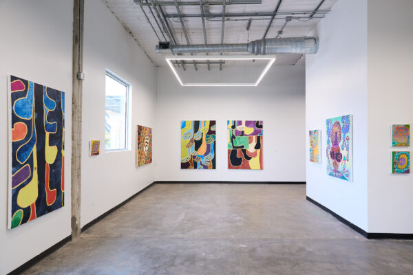 Installation view of large format paintings on a white wall