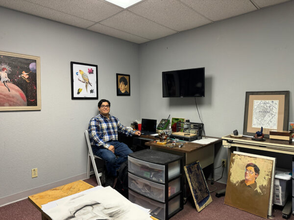 A photograph of artist Freddy Gonzales in his studio at the Center for Contemporary Arts in Abilene.