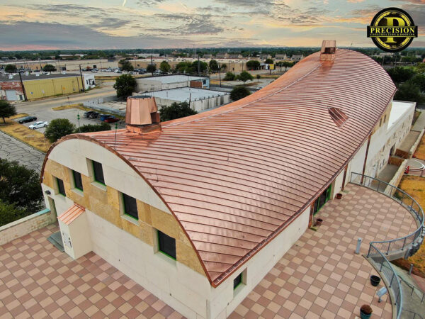 A photograph of a new copper roof installed at the San Angelo Museum of Fine Arts.
