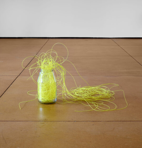 Sculpture of yellow fishing line in a mason jar