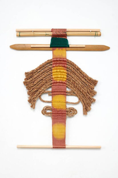 Photo of an abstracted woven piece with rope and wood