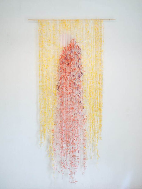 Yellow and pink sculpture made of hand spun paper